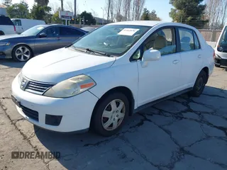 2007 Nissan Versa 1.8 SL with VIN 3N1BC11EX7L460203, listed as a IAAI auction lot 41462656 with 160,142 mi miles. Bid and sale history available at carsss.com. Image 2.