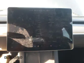 2023 Tesla Model 3 z VIN 5YJ3E1EA6PF621759, wystawiony jako Copart lot #63669045 z przebiegiem 20 094 mil mil oraz Szkoda całkowita • Salvage title. Historia ofert i sprzedaży dostępna na DreamBid. Obrazek 9.