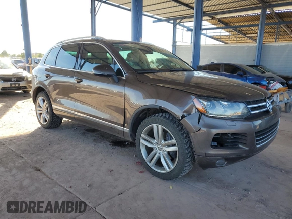 2012 Volkswagen Touareg Exec with VIN WVGEF9BP8CD008665, listed as a Copart auction lot 84611354 with 103,090 mi miles and Salvage Title. Bid and sale history available at DreamBid. Image 4.