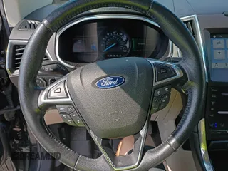 2019 Ford Edge Titanium with VIN 2FMPK4K91KBC09840, listed as a IAAI auction lot 42870883 with 118,778 mi miles and . Bid and sale history available at DreamBid. Image 35.