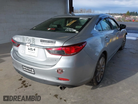 2017 Mazda Mazda6 Touring with VIN JM1GL1V50H1144637, listed as a IAAI auction lot 41849569 with 100,047 mi miles. Bid and sale history available at carsss.com. Image 4.
