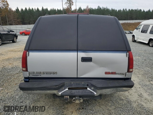 1994 GMC Suburban z VIN 1GKEC16K4RJ762562, wystawiony jako Copart lot #81242184 z przebiegiem 182 583 mil mil oraz Szkoda całkowita • Salvage title. Historia ofert i sprzedaży dostępna na DreamBid. Obrazek 6.