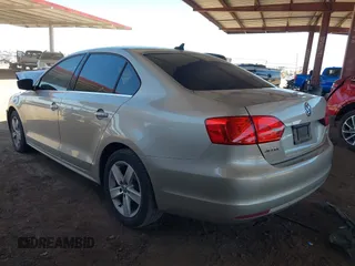 2014 Volkswagen Jetta TDI w/Premium with VIN 3VWLL7AJ1EM228062, listed as a IAAI auction lot 42256650 with 218,955 mi miles and . Bid and sale history available at DreamBid. Image 3.