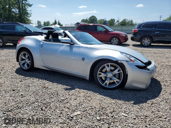 2012 Nissan 370Z Touring with VIN JN1AZ4FH3CM370910, listed as a Copart auction lot 65940005 with 23,009 mi miles and Salvage title. Bid and sale history available at DreamBid. Image 4.