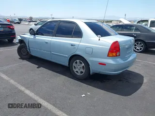2005 Hyundai Accent GLS z VIN KMHCG45C85U591452, wystawiony jako IAAI lot #42114303 z przebiegiem 173 832 mil mil oraz . Historia ofert i sprzedaży dostępna na DreamBid. Obrazek 3.