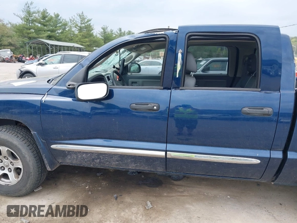 2005 Dodge Dakota Laramie with VIN 1D7HW58NX5S227633, listed as a IAAI auction lot 42122619 with 85,338 mi miles and . Bid and sale history available at DreamBid. Image 6.