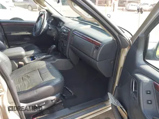 2004 Jeep Grand Cherokee Limited with VIN 1J4GW58N54C299669, listed as a IAAI auction lot 42369745 with 90,240 mi miles and . Bid and sale history available at DreamBid. Image 5.
