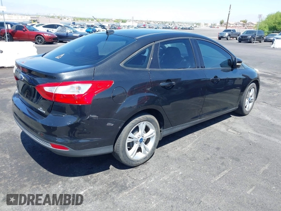 2013 Ford Focus SE with VIN 1FADP3F21DL264359, listed as a IAAI auction lot 42562576 with 167,624 mi miles and . Bid and sale history available at DreamBid. Image 4.