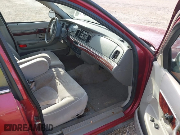 2000 Mercury Grand Marquis LS z VIN 2MEFM75W1YX736283, wystawiony jako IAAI lot #41879063 z przebiegiem 114 535 mil mil oraz . Historia ofert i sprzedaży dostępna na DreamBid. Obrazek 5.