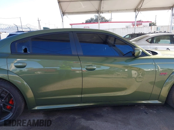 2022 Dodge Charger Scat Pack Widebody with VIN 2C3CDXGJ1NH216763, listed as a IAAI auction lot 41259159 with 32,610 mi miles and . Bid and sale history available at DreamBid. Image 13.