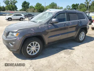 2016 Jeep Grand Cherokee Laredo with VIN 1C4RJFAG2GC328841, listed as a Copart auction lot 63553435 with 100,472 mi miles and Salvage title. Bid and sale history available at DreamBid. Image 1.