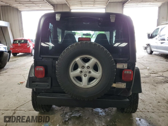 2002 Jeep Wrangler Sport with VIN 1J4FA49S62P713475, listed as a Copart auction lot 59299965 with 114,654 mi miles and Non repairable. Bid and sale history available at DreamBid. Image 6.