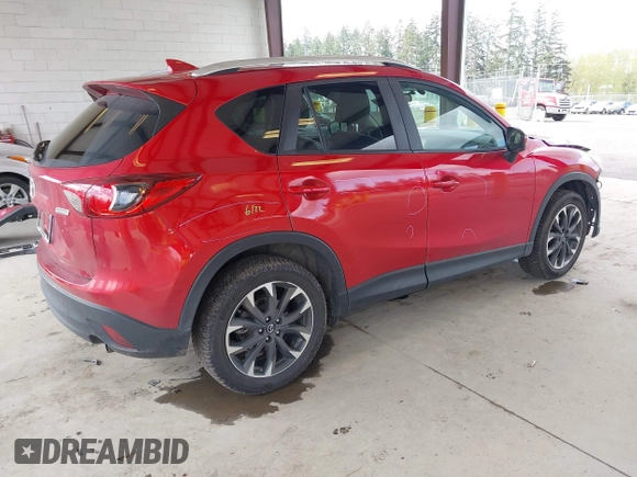 2016 Mazda CX-5 Grand Touring with VIN JM3KE4DY3G0688062, listed as a IAAI auction lot 42025169 with 59,867 mi miles and . Bid and sale history available at carsss.com. Image 4.