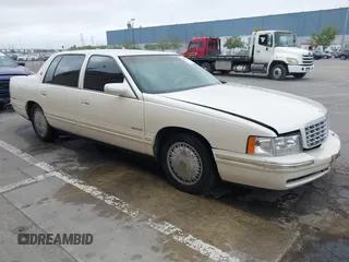 1999 Cadillac DeVille DHS z VIN 1G6KE54Y7XU770239, wystawiony jako IAAI lot #42078657 z przebiegiem 146 283 mil mil oraz . Historia ofert i sprzedaży dostępna na DreamBid. Obrazek 1.