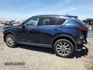 2020 Mazda CX-5 Grand Touring z VIN JM3KFADM4L0794765, wystawiony jako Copart lot #63850005 z przebiegiem 53 270 mil mil oraz Szkoda całkowita • Salvage title. Historia ofert i sprzedaży dostępna na DreamBid. Obrazek 2.