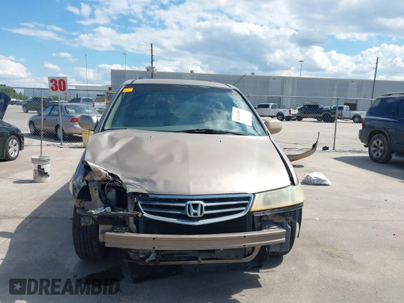 2003 Honda Odyssey EX-L z VIN 5FNRL18993B116892, wystawiony jako IAAI lot #42241908 z przebiegiem 276 223 mil mil oraz . Historia ofert i sprzedaży dostępna na DreamBid. Obrazek 13.