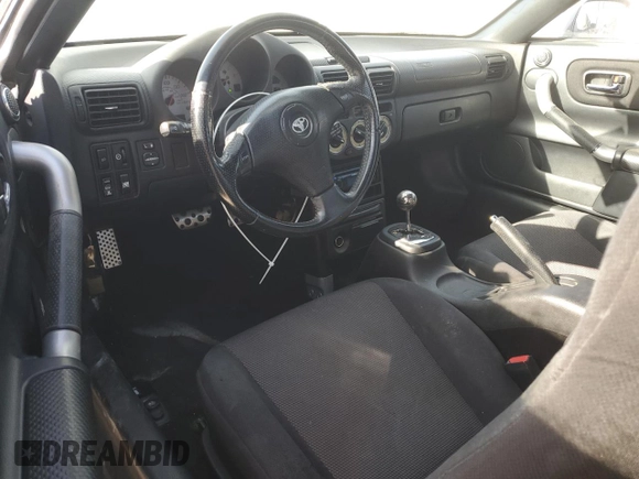 2003 Toyota MR2 z VIN JTDFR320330059885, wystawiony jako Copart lot #86158554 z przebiegiem 178 809 mil mil oraz Szkoda całkowita • Salvage title. Historia ofert i sprzedaży dostępna na DreamBid. Obrazek 8.