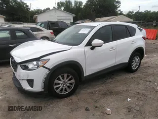 2014 Mazda CX-5 Touring z VIN JM3KE4CY0E0303748, wystawiony jako IAAI lot #42127406 z przebiegiem Nie podano mil oraz . Historia ofert i sprzedaży dostępna na DreamBid. Obrazek 16.