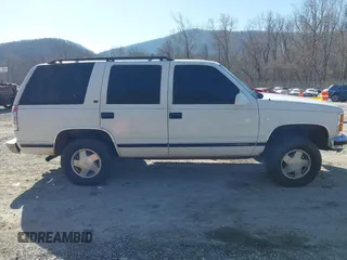 1999 GMC Yukon with VIN 1GKEK13R8XJ763098, listed as a IAAI auction lot 41753745 with 209,451 mi miles. Bid and sale history available at carsss.com. Image 14.