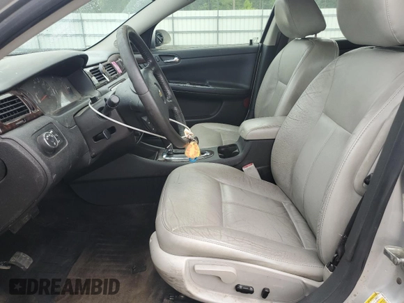 2014 Chevrolet Impala LT with VIN 2G1WB5E33E1165713, listed as a Copart auction lot 60591585 with 203,323 mi miles and Salvage title. Bid and sale history available at DreamBid. Image 7.