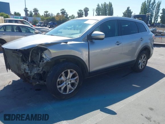 2011 Mazda CX-9 Sport with VIN JM3TB2BVXB0307360, listed as a IAAI auction lot 42580629 with 136,928 mi miles and . Bid and sale history available at DreamBid. Image 2.