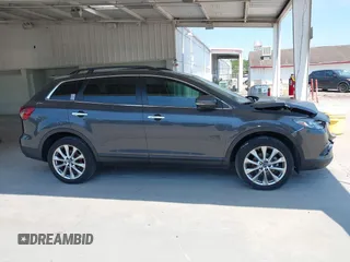 2014 Mazda CX-9 Grand Touring z VIN JM3TB2DA0E0434181, wystawiony jako IAAI lot #42295436 z przebiegiem 78 372 mil mil oraz . Historia ofert i sprzedaży dostępna na DreamBid. Obrazek 13.
