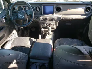 2023 Jeep Wrangler Sport S with VIN 1C4HJXDG3PW602849, listed as a Copart auction lot 46718365 with 24,308 mi miles and Salvage Title. Bid and sale history available at DreamBid. Image 8.