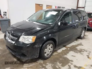 2012 Dodge Grand Caravan SE with VIN 2C4RDGBG8CR155758, listed as a IAAI auction lot 41300951 with 126,209 mi miles and . Bid and sale history available at DreamBid. Image 2.