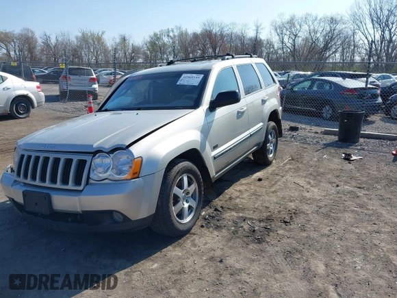 2008 Jeep Grand Cherokee Laredo with VIN 1J8GR48K28C169859, listed as a IAAI auction lot 41965149 with 166,069 mi miles. Bid and sale history available at carsss.com. Image 2.