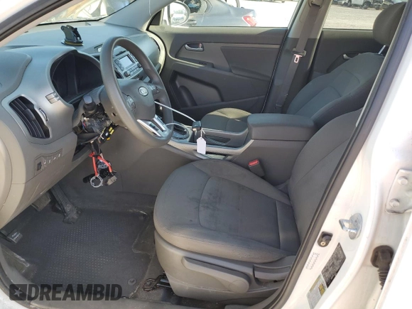 2012 Kia Sportage LX with VIN KNDPBCA21C7233424, listed as a Copart auction lot 61829465 with 129,526 mi miles and Salvage title. Bid and sale history available at DreamBid. Image 7.
