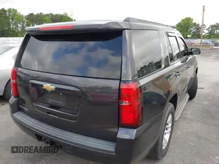 2015 Chevrolet Tahoe LS with VIN 1GNSCAKC0FR245826, listed as a IAAI auction lot 42282590 with 164,208 mi miles and . Bid and sale history available at DreamBid. Image 4.