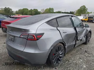 2024 Tesla Model Y Performance with VIN 7SAYGDEF2RA322351, listed as a IAAI auction lot 41953896 with 8,959 mi miles and . Bid and sale history available at carsss.com. Image 4.