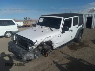 2013 Jeep Wrangler Unlimited Rubicon 10th Anniversary with VIN 1C4HJWFG0DL681417, listed as a IAAI auction lot 29833951 with 118,673 mi miles and . Bid and sale history available at DreamBid. Image 2.