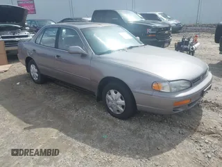 1996 Toyota Camry DX with VIN 4T1BG12K8TU762073, listed as a IAAI auction lot 41606136 with 254,939 mi miles. Bid and sale history available at carsss.com. Image 1.