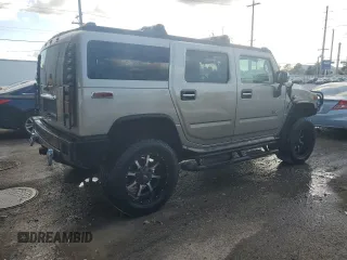 2003 Hummer H2 with VIN 5GRGN23U13H147071, listed as a Copart auction lot 82255674 with 272,215 mi miles and Salvage Title. Bid and sale history available at carsss.com. Image 3.