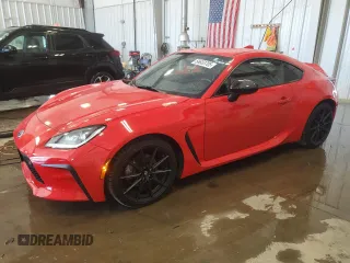 2023 Toyota 86 Premium z VIN JF1ZNBF12P8762798, wystawiony jako Copart lot #56633705 z przebiegiem 15 547 mil mil oraz Szkody całkowita. Historia ofert i sprzedaży dostępna na DreamBid. Obrazek 1.