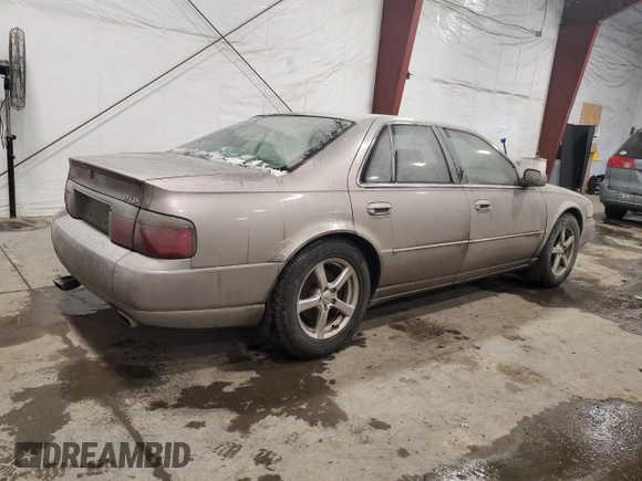 1998 Cadillac Seville STS z VIN 1G6KY5490WU916771, wystawiony jako Copart lot #58699555 z przebiegiem 129 944 mil mil oraz Nie do naprawy. Historia ofert i sprzedaży dostępna na DreamBid. Obrazek 3.