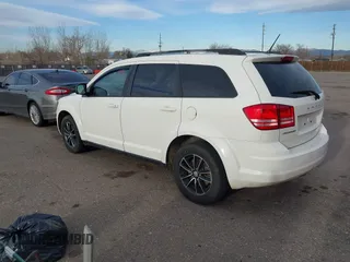 2017 Dodge Journey SE with VIN 3C4PDCAB6HT670624, listed as a IAAI auction lot 41777947 with 143,496 mi miles and . Bid and sale history available at DreamBid. Image 3.