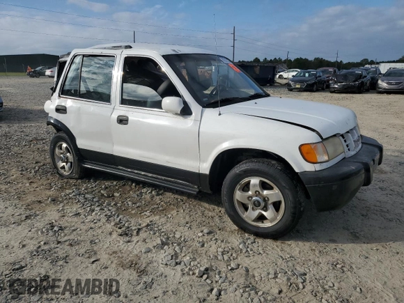 1999 Kia Sportage with VIN KNDJA7233X5600719, listed as a Copart auction lot 80529384 with 56,657 mi miles and Salvage Title. Bid and sale history available at carsss.com. Image 4.