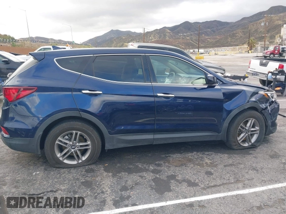2017 Hyundai Santa Fe 2.4L z VIN 5XYZT3LB1HG489625, wystawiony jako IAAI lot #41784791 z przebiegiem 95 435 mil mil oraz . Historia ofert i sprzedaży dostępna na DreamBid. Obrazek 13.