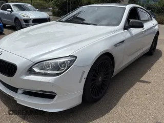 2015 BMW 6 Series 650i xDrive with VIN WBA6B4C57FD899926, listed as a Copart auction lot 54974505 with 63,570 mi miles and Salvage Title. Bid and sale history available at carsss.com. Image 2.