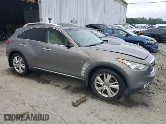 2014 Infiniti QX70 with VIN JN8CS1MW7EM412867, listed as a Copart auction lot 60054195 with 148,064 mi miles and Salvage title. Bid and sale history available at DreamBid. Image 4.