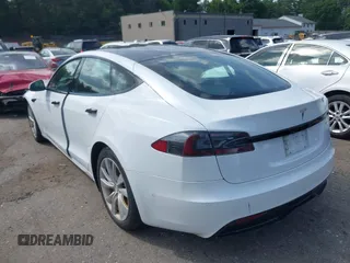 2021 Tesla Model S Long Range with VIN 5YJSA1E57MF428512, listed as a IAAI auction lot 42511020 with 29,611 mi miles and . Bid and sale history available at DreamBid. Image 14.
