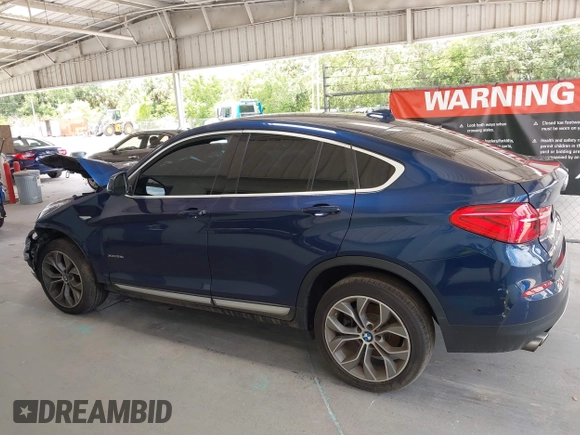 2015 BMW X4 xDrive28i with VIN 5UXXW3C51F0M87268, listed as a IAAI auction lot 42366363 with 143,285 mi miles and . Bid and sale history available at DreamBid. Image 15.