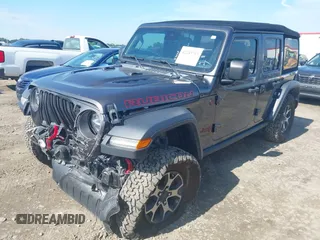 2021 Jeep Wrangler Unlimited Rubicon with VIN 1C4HJXFN5MW509483, listed as a IAAI auction lot 42245703 with 59,461 mi miles and . Bid and sale history available at DreamBid. Image 17.