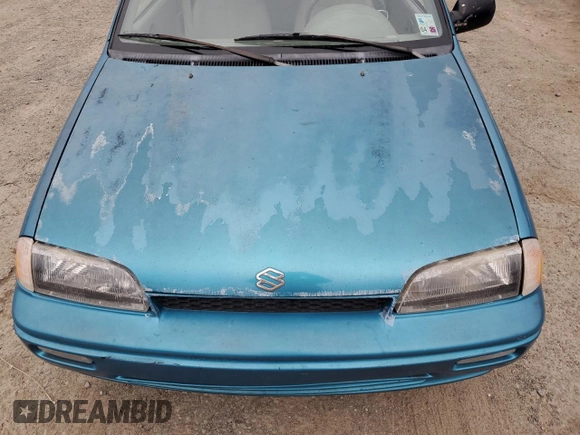 1993 Suzuki Swift z VIN 2S2AC35S5P6601869, wystawiony jako Copart lot #44993725 z przebiegiem 166 429 mil mil oraz Szkody całkowita. Historia ofert i sprzedaży dostępna na DreamBid. Obrazek 13.