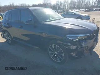 2021 BMW X5 xDrive40i with VIN 5UXCR6C09M9F83785, listed as a IAAI auction lot 41828697 with 57,863 mi miles. Bid and sale history available at carsss.com. Image 1.