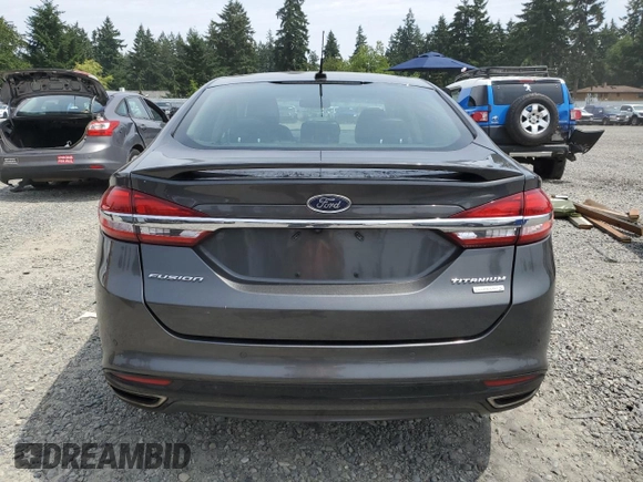 2017 Ford Fusion Titanium z VIN 3FA6P0K95HR139060, wystawiony jako Copart lot #62200755 z przebiegiem 106 133 mil mil oraz Szkoda całkowita • Salvage title. Historia ofert i sprzedaży dostępna na DreamBid. Obrazek 6.