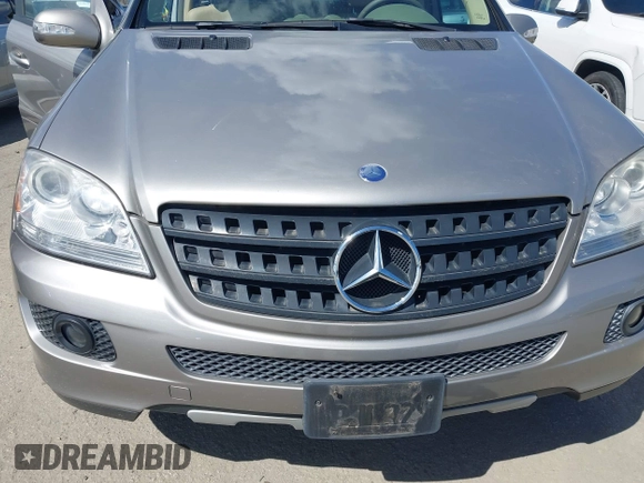 2006 Mercedes-Benz M 350 with VIN 4JGBB86E06A018999, listed as a IAAI auction lot 41923582 with 77,121 mi miles and . Bid and sale history available at DreamBid. Image 6.
