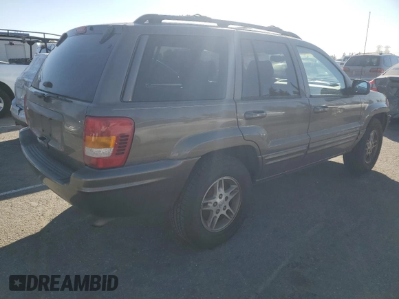 1999 Jeep Grand Cherokee Limited with VIN 1J4G268SXXC759016, listed as a Copart auction lot 80307534 with 215,870 mi miles and Salvage title. Bid and sale history available at DreamBid. Image 3.